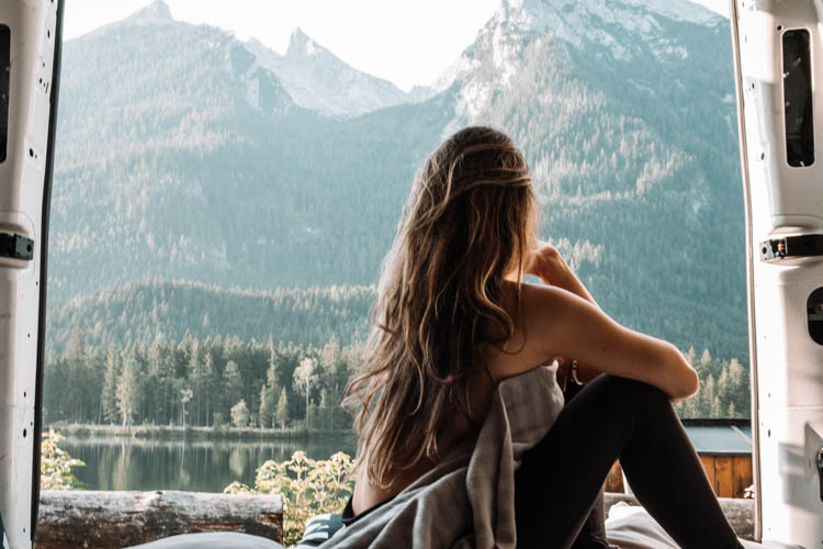 Girl in a cabin in a remote mountains location